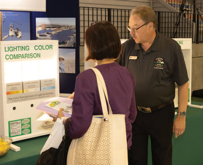man speaking with woman at annual meeting
