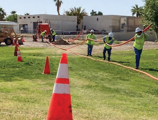 MEC employees installing fiber