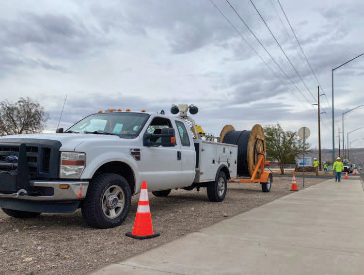 bucket trucks on road